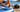 Paddler fitting a pump hose adapter to a stand-up paddle board valve