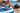 Paddler fitting a pump hose adapter to a stand-up paddle board valve