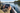 Angler adjusting a portable fish finder on a calm freshwater lake